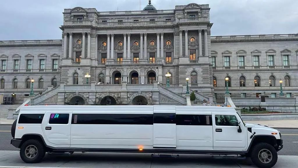 White Hummer stretch limousine full side profile at the Library of Congress, Smart Limo Rental Washington DC