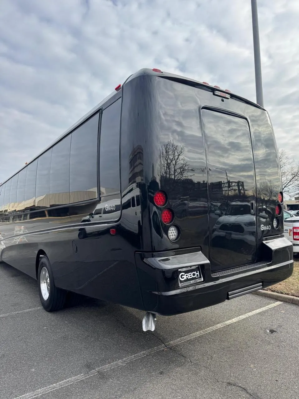 Black executive mini bus rear three-quarter exterior view, Smart Limo Rental Washington DC