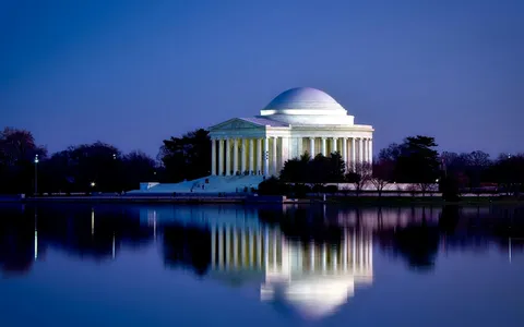 Jefferson Memorial framed by cherry blossoms in bloom