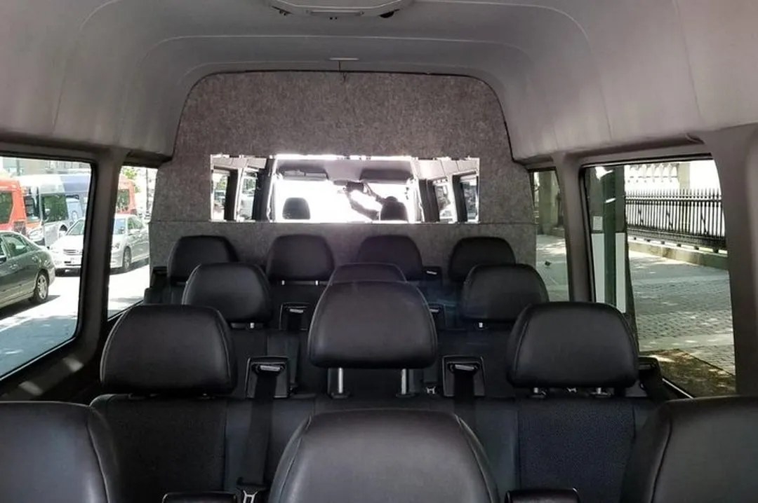 Mercedes Sprinter van interior with leather seating and walk-through cabin, Smart Limo Rental DC