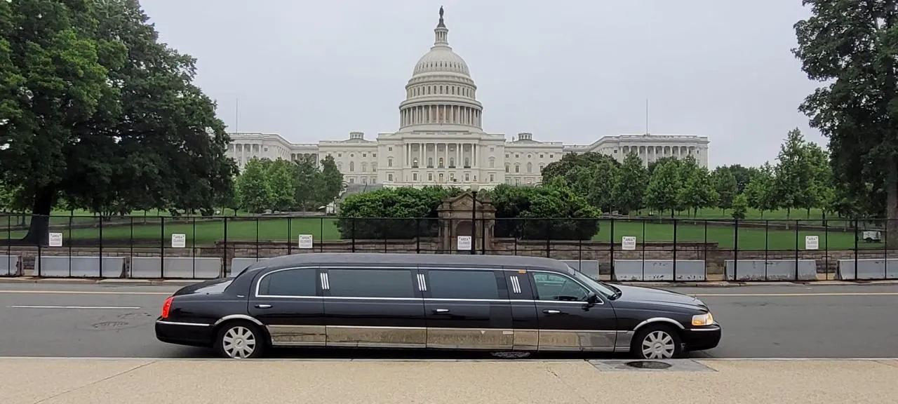 Black Lincoln stretch limousine parked in front of the US Capitol on a private DC tour, Smart Limo Rental