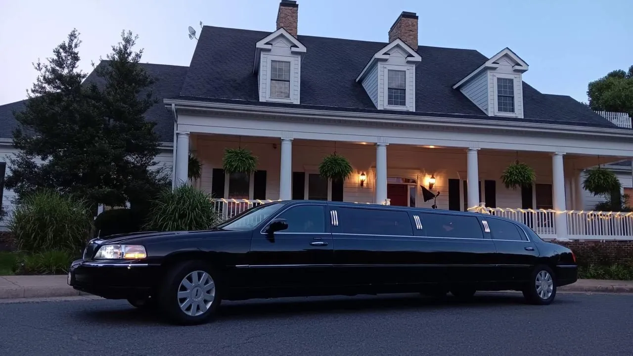Black stretch limousine arriving at a Virginia wedding venue in the evening, Smart Limo Rental
